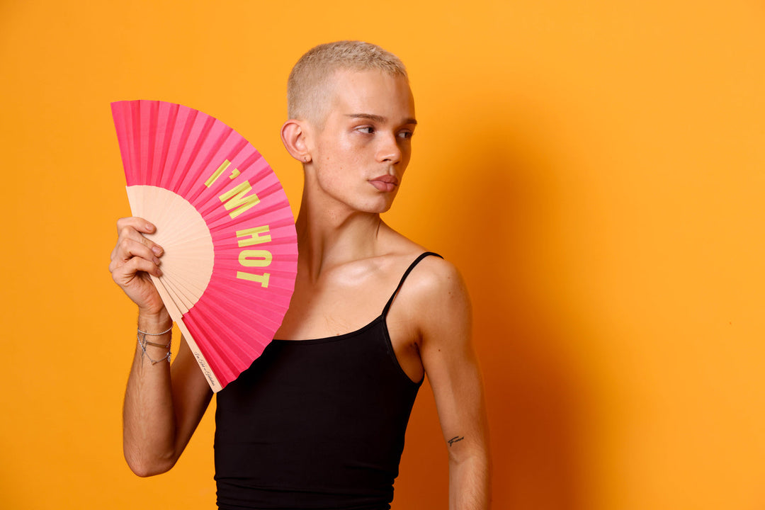 person holding a fan that says i'm hot