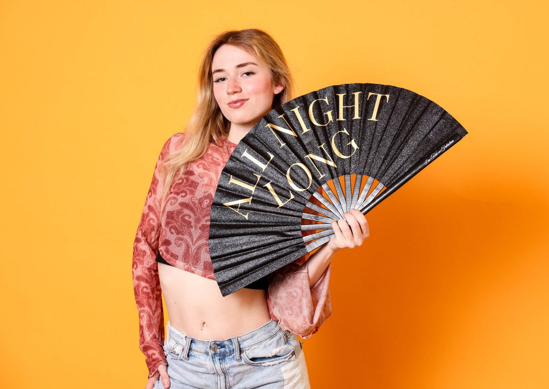 girl holding fan with all night long on the fan