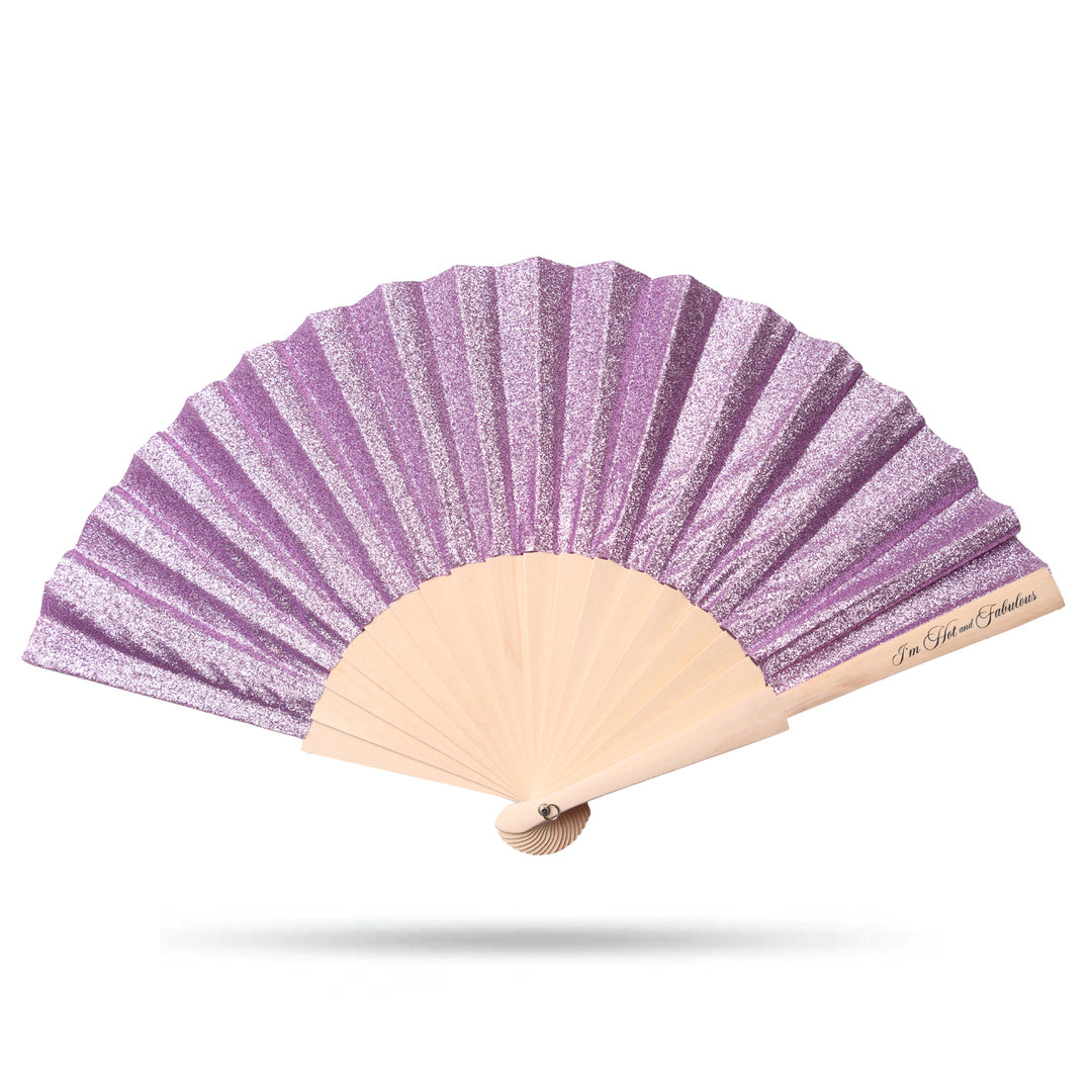 Purple and beige hand fan on a white background