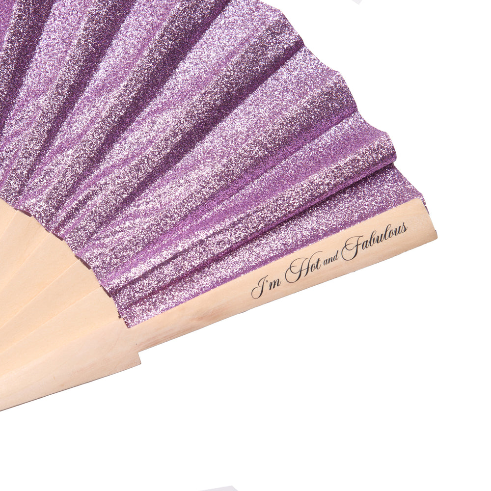 Purple glittery fabric with wooden handle and 'I'm Hot and Fabulous' text on a white background