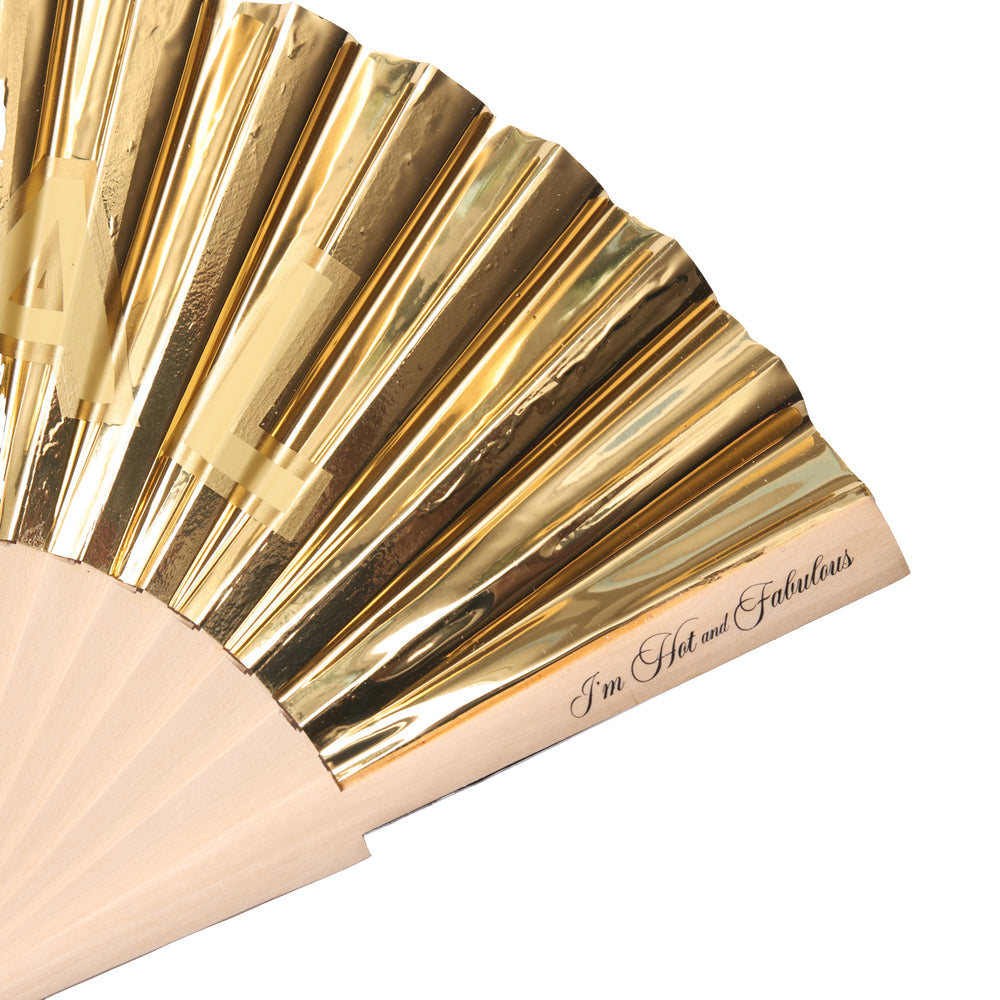 Gold leaf fan with beige handle and 'I'm Hot and Fabulous' text on a white background