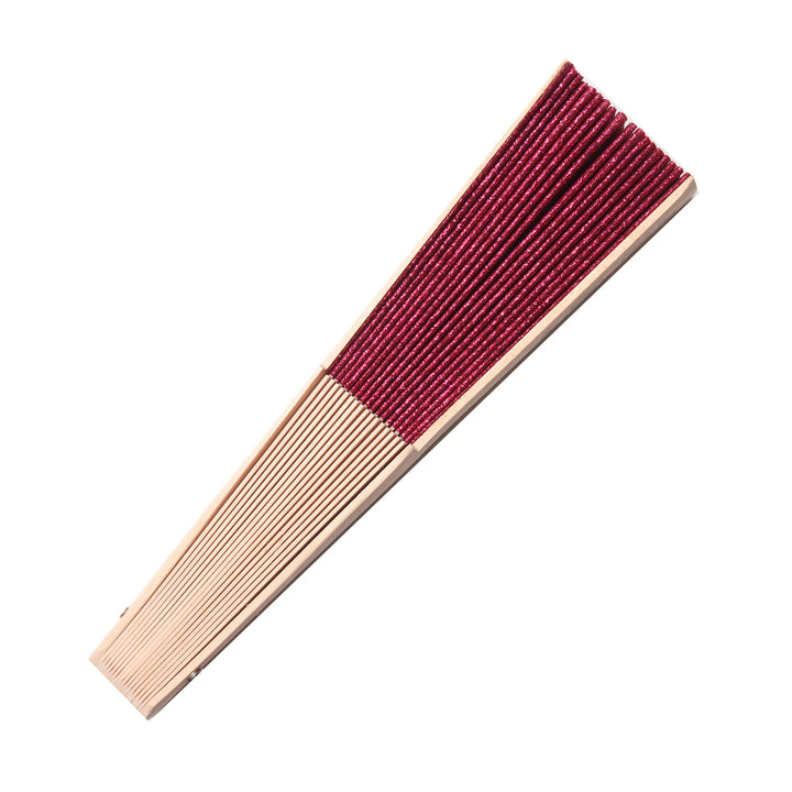 side view of pink hand fan