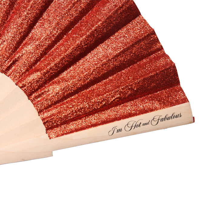 side view of orange hand fan