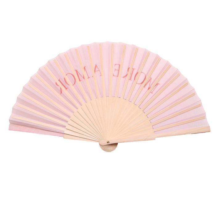 Pink hand fan with 'more amore' text on a white background