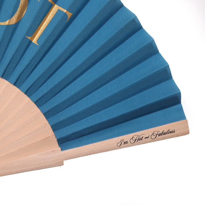 Blue folding fan with gold lettering and wooden handle on a white background