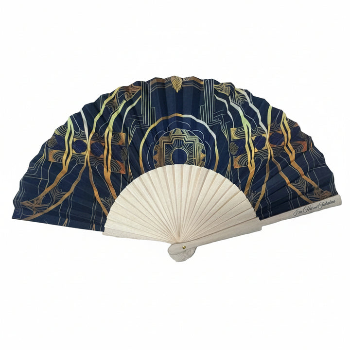Decorative fan with black and gold design wth a white background