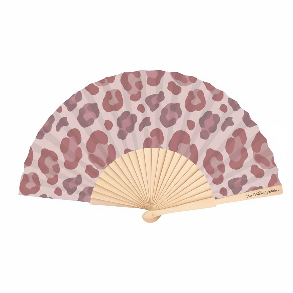 Handheld fan with leopard print design on a white background
