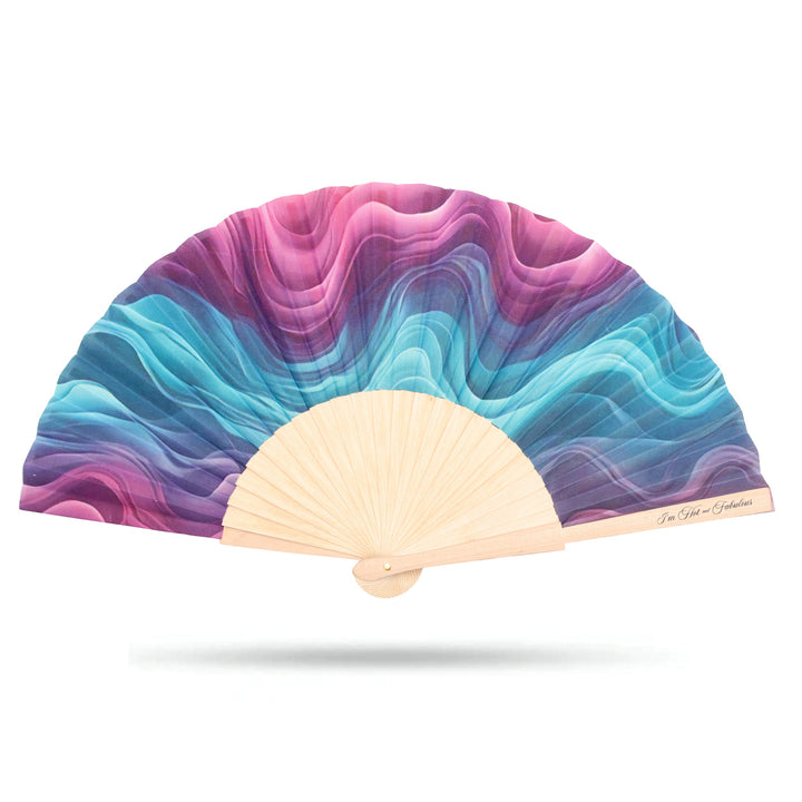 Colorful hand fan with wavy pattern on a white background