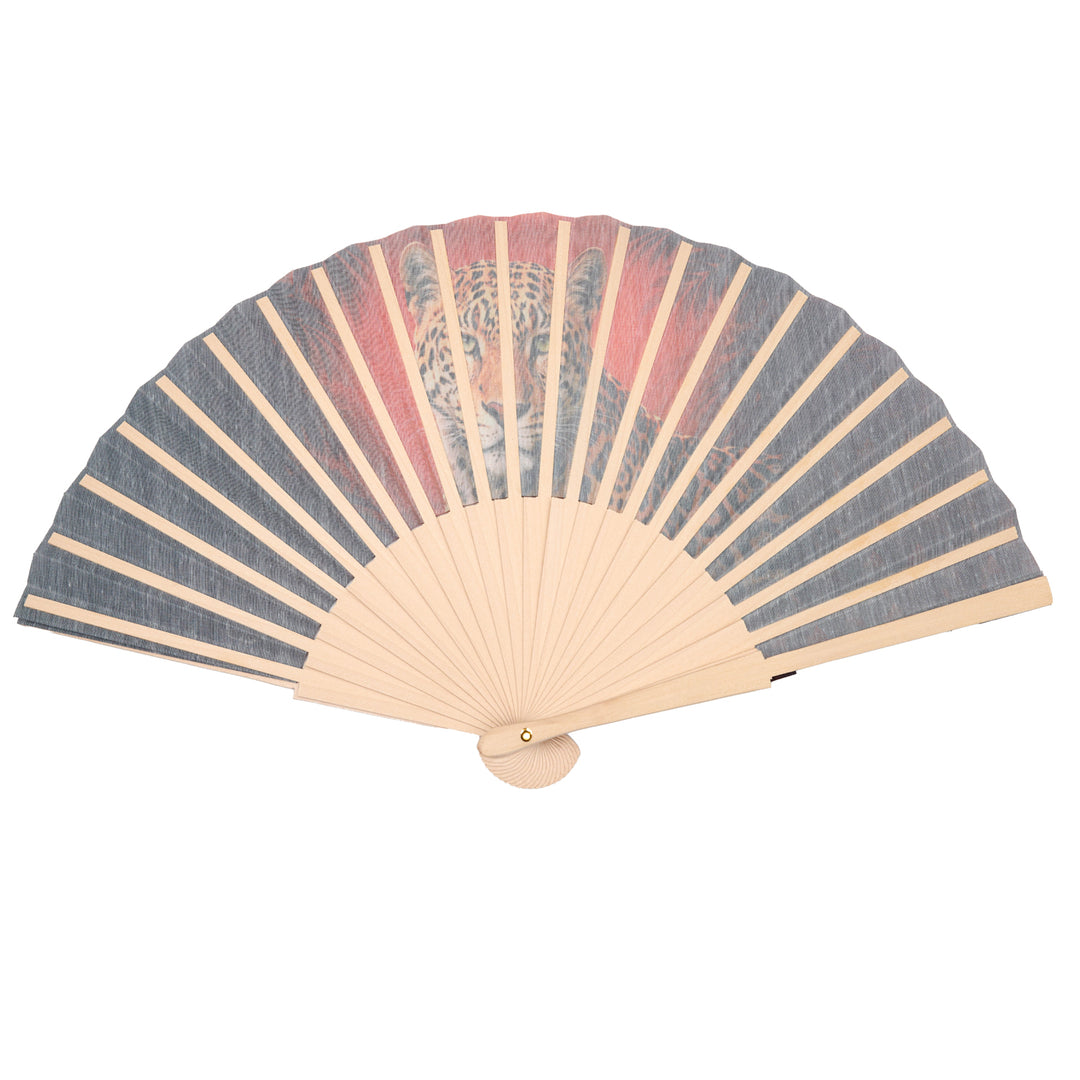 Handheld fan with leopard design on a white background