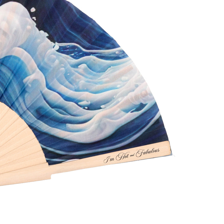 Hand fan with blue wave design and 'I'm Hot and Fabulous' text on a white background