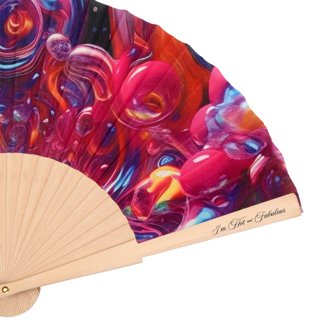Colorful abstract design on a hand fan with wooden frame