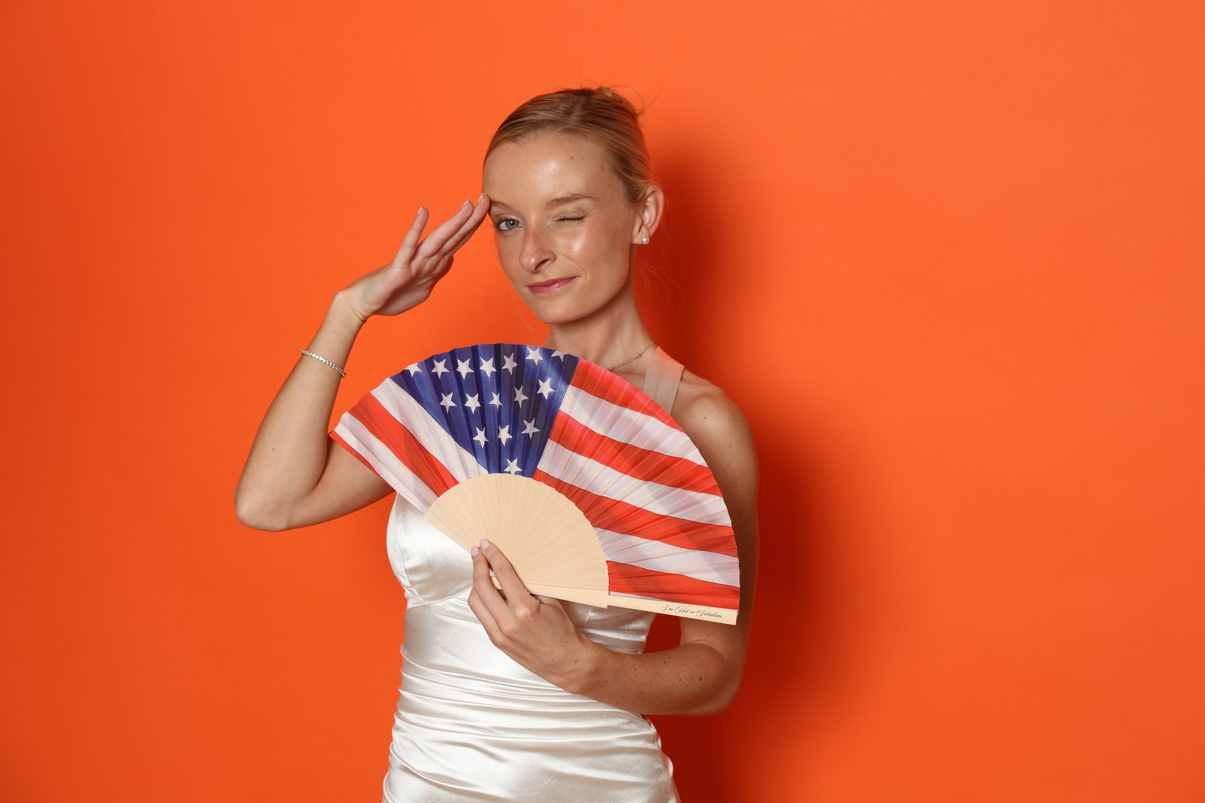 Woman with American flag hand fan
