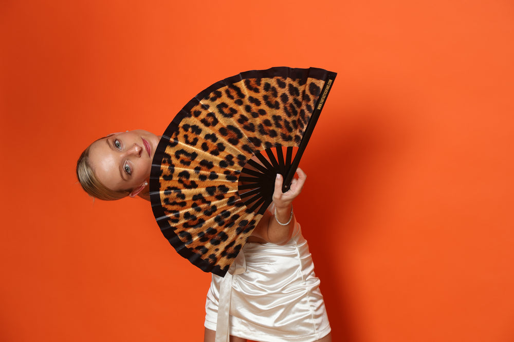 woman with xl leopard print fan

