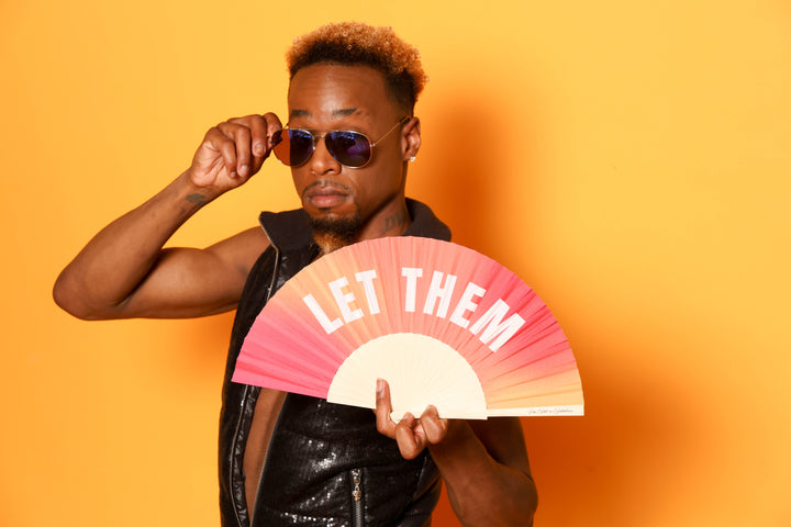 Man with Let Them Hand Fan