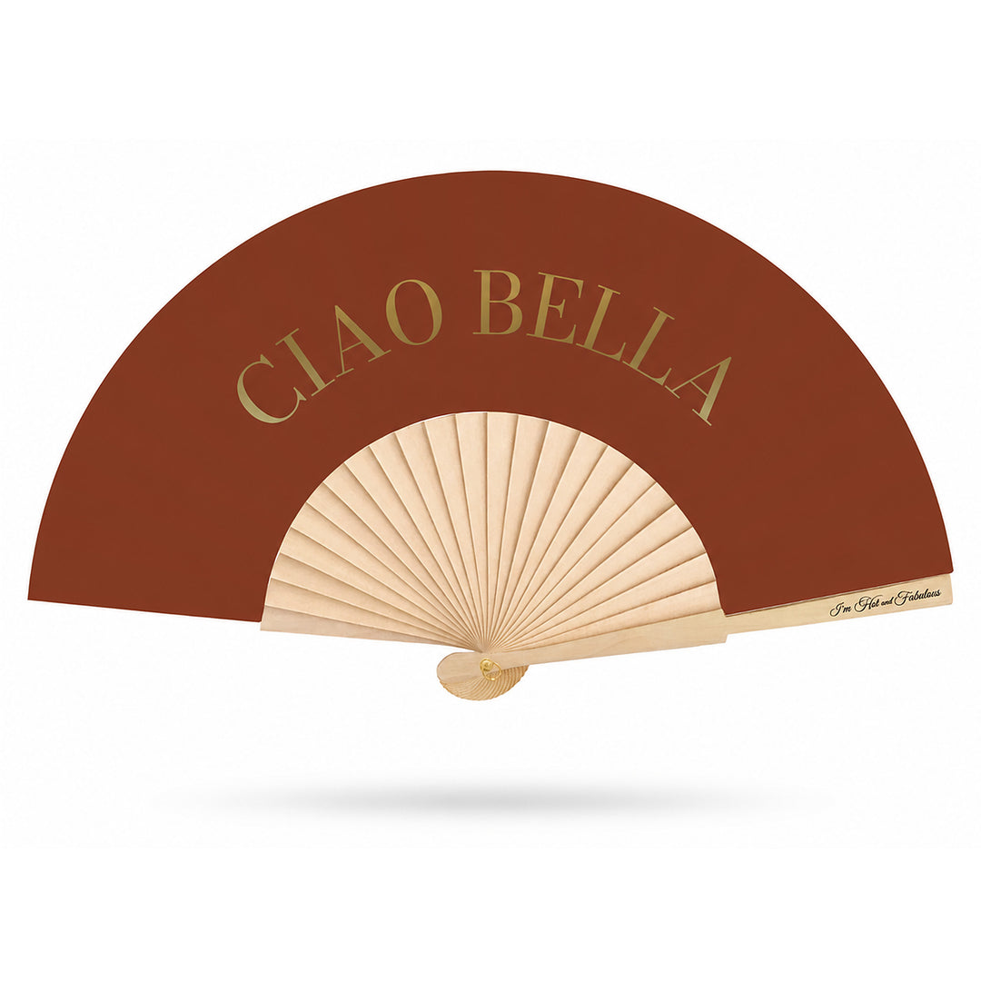 A folding hand fan with a warm brown outer panel, natural beige ribs, and gold foil lettering that reads 'CIAO BELLA' on the upper half, set against a clean white background with a soft drop shadow.
