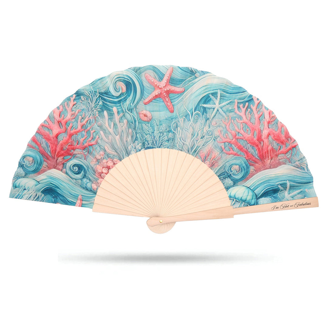 Handheld fan with ocean-themed design featuring coral and starfish on a white background