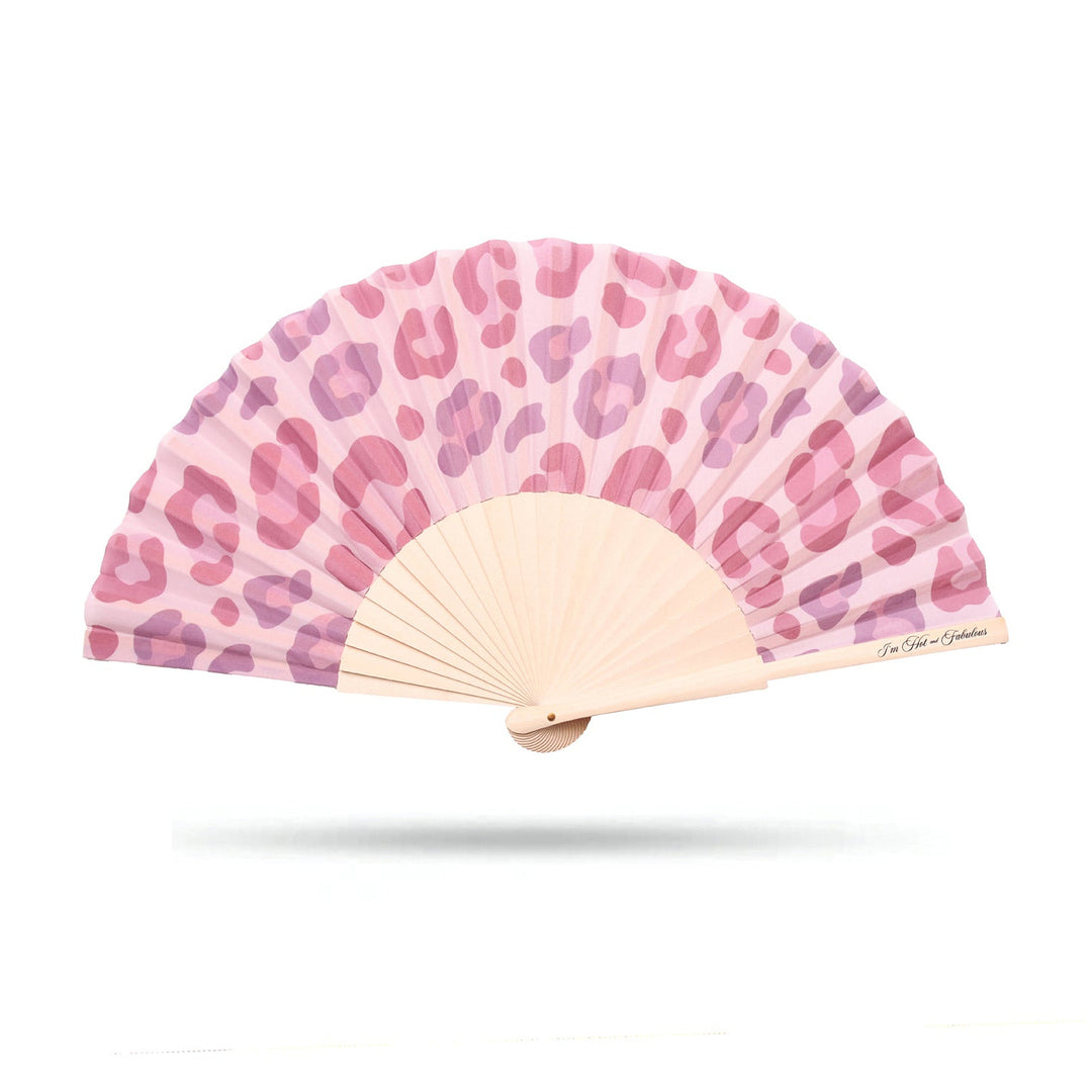 Handheld fan with pink leopard print design on a white background