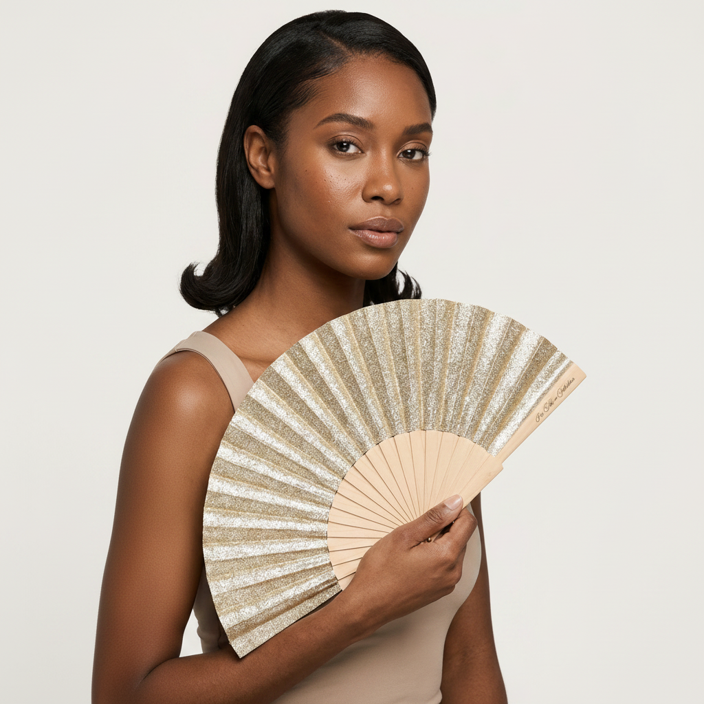 Woman holding a decorative fan against a plain background