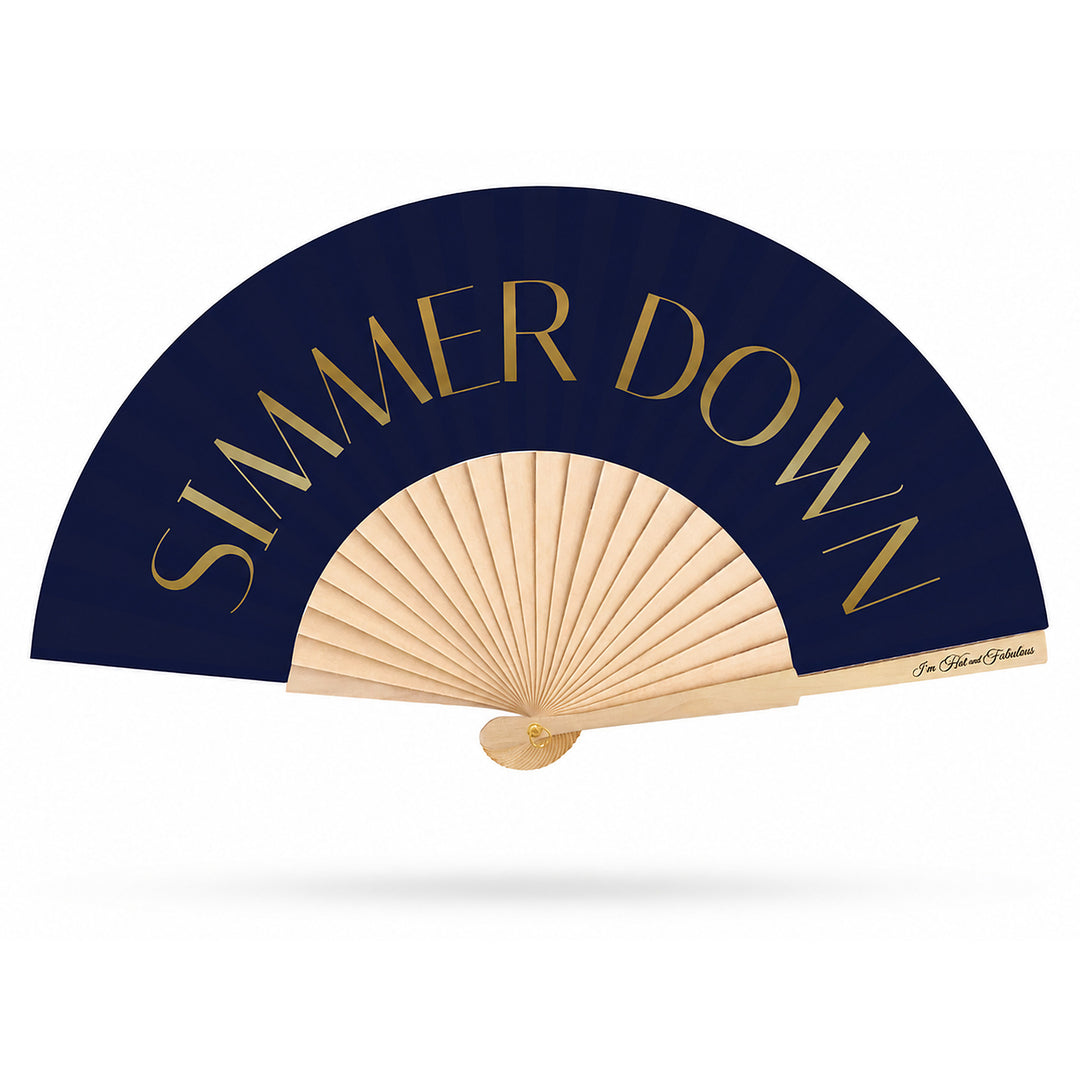 Simmer Down hand fan with gold shimmer lettering on a white background