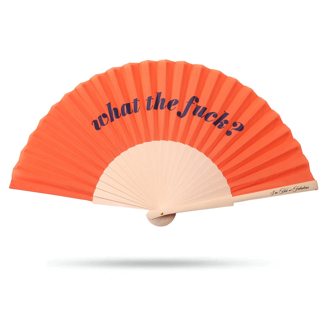 Orange hand fan open, with the words what the f*ck in blue script across the top and natural wood ribs, on a white background